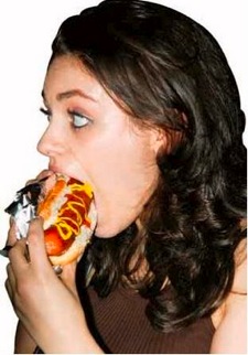 Mila Kunis eats a hotdog